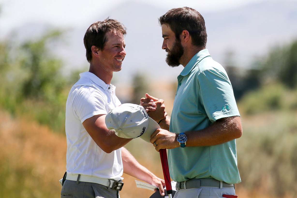 Riley Arp, left, and Tom Whitney shake hands during the Utah Championship at Thanksgiving Point Golf Course in Lehi on Thursday, July 21, 2016. (Photo: Spenser Heaps, Deseret News)