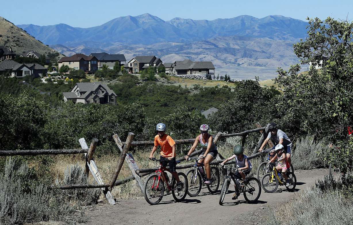 Members of the Eric and Melissa Tennant family ride mountain bikes at Corner Canyon in Draper on Thursday, July 21, 2016. (Photo: Ravell Call, Deseret News)