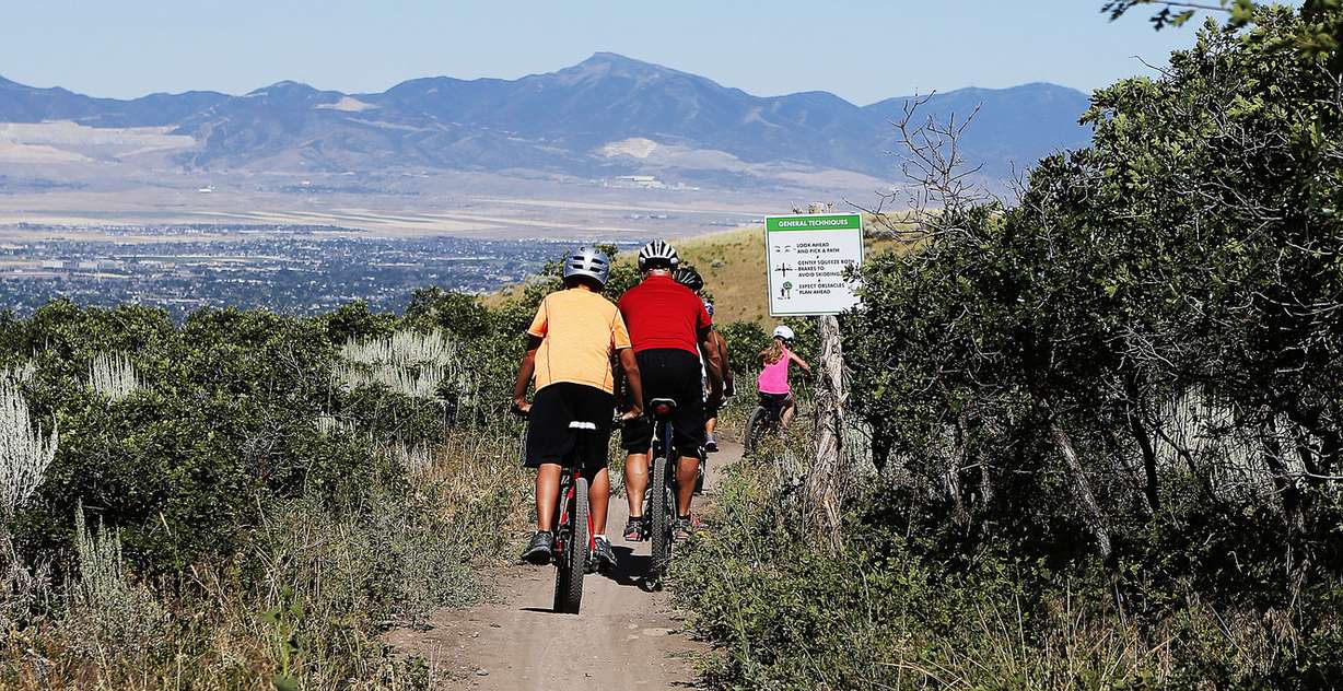 Members of the Eric and Melissa Tennant family ride mountain bikes at Corner Canyon in Draper on Thursday, July 21, 2016. (Photo: Ravell Call, Deseret News)