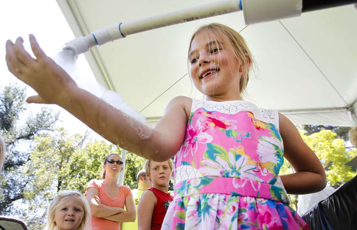 Priya Davies, 6, enjoys playing with bubbles at The Days of ’47 Family Festival in Salt Lake City on Saturday, July 23, 2016. (Photo: Weston Kenney, Deseret News)