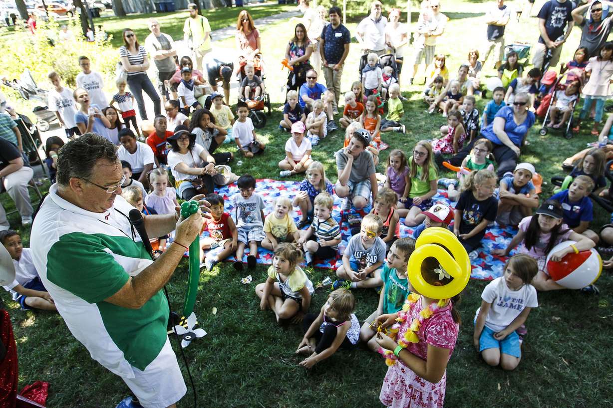Kids enjoy a magic show preformed by Paul Brewer, left, at The Days of ’47 Family Festival in Salt Lake City on Saturday, July 23, 2016. (Photo: Weston Kenney, Deseret News)