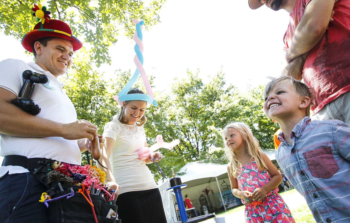 Sutton Fronce, 3, right, gets excited after receiving a balloon at The Days of ’47 Family Festival in Salt Lake City on Saturday, July 23, 2016. (Photo: Weston Kenney, Deseret News)