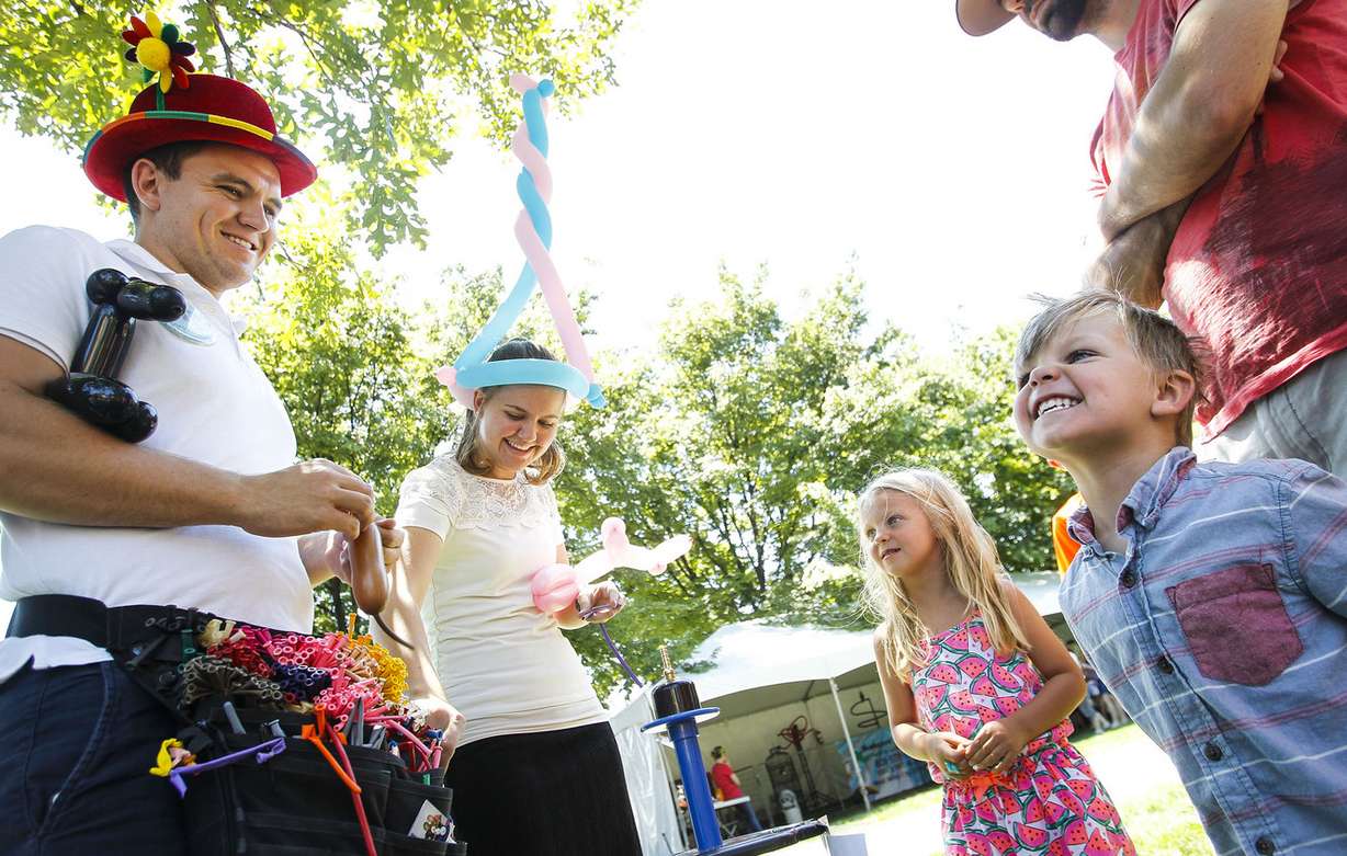 Sutton Fronce, 3, right, gets excited after receiving a balloon at The Days of ’47 Family Festival in Salt Lake City on Saturday, July 23, 2016. (Photo: Weston Kenney, Deseret News)