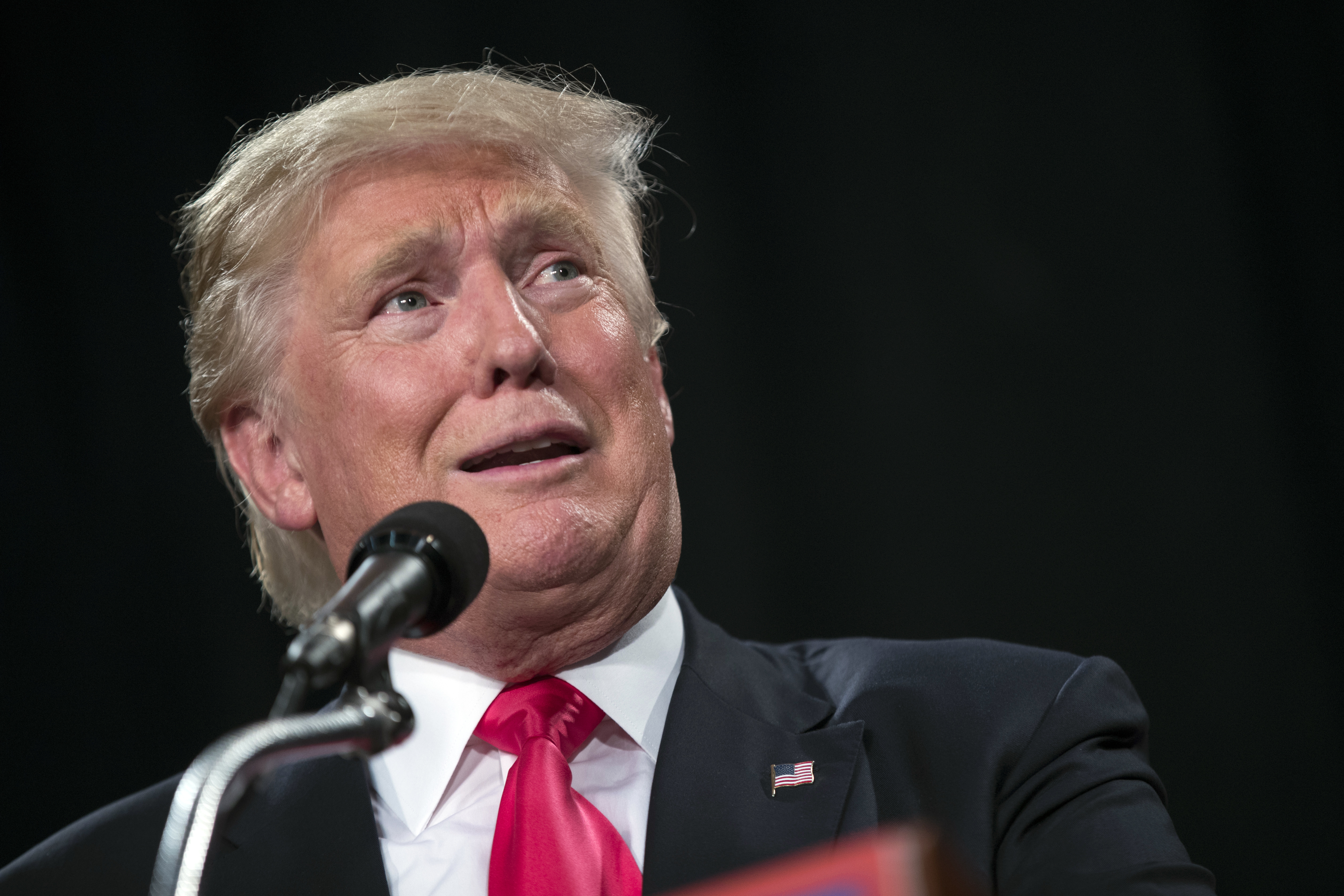 The Latest: Clinton sees 'biggest crack' in glass ceiling
