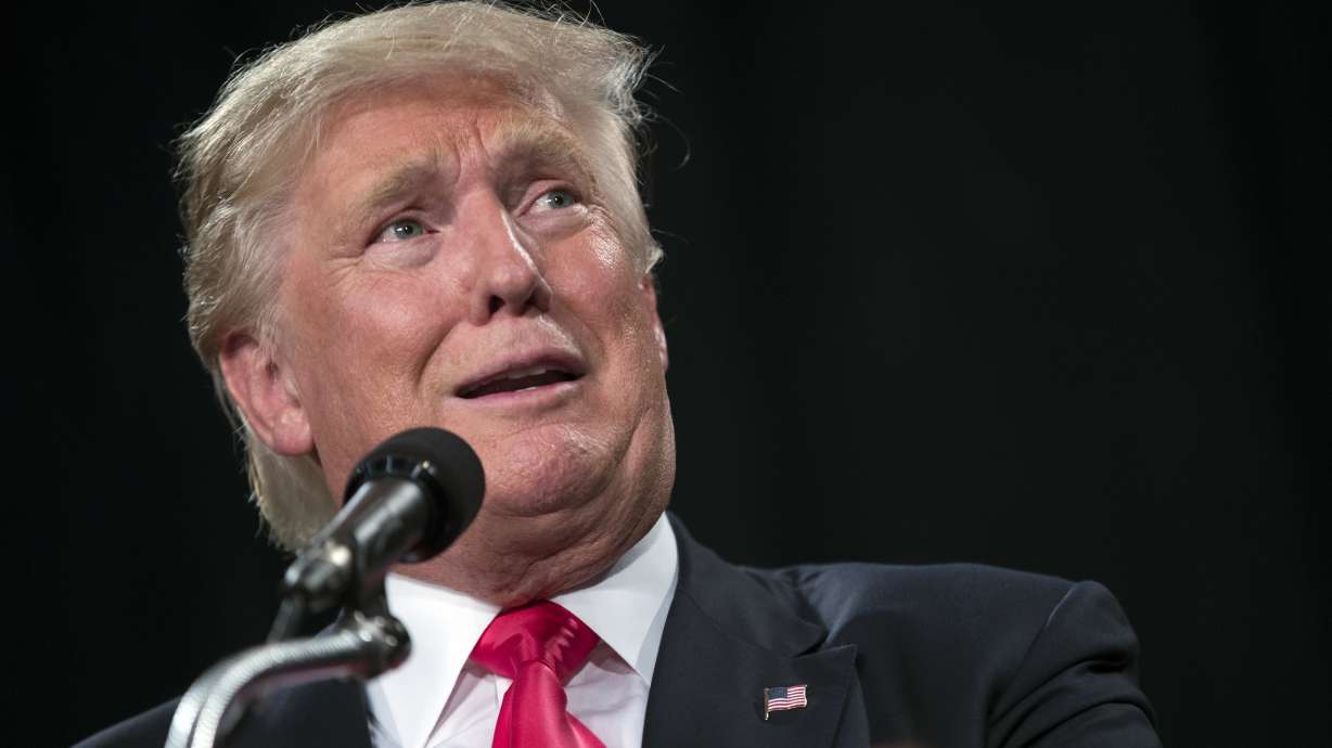 The Latest: Clinton sees 'biggest crack' in glass ceiling