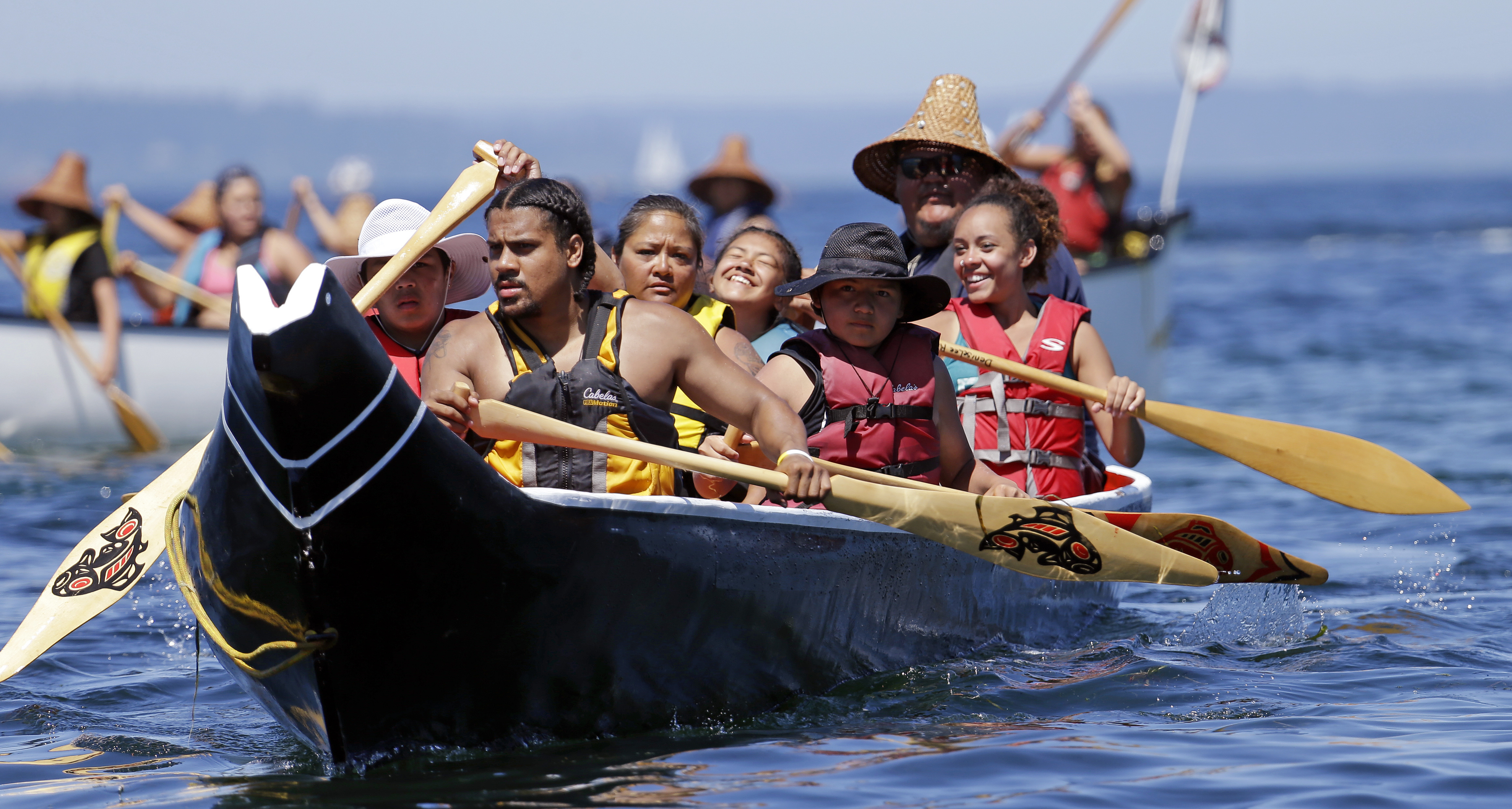 Tribal canoes arrive at Seattle beach in annual celebration