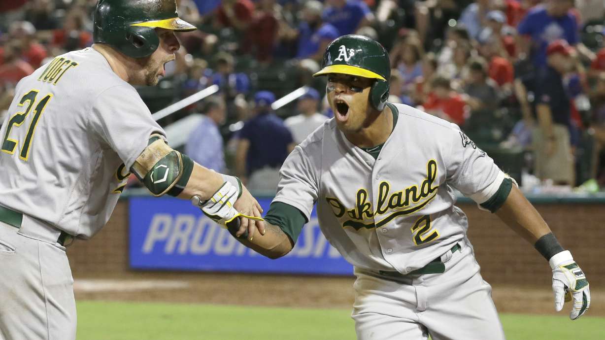 Davis homers twice, Crisp goes deep as A's beat Rangers 6-4
