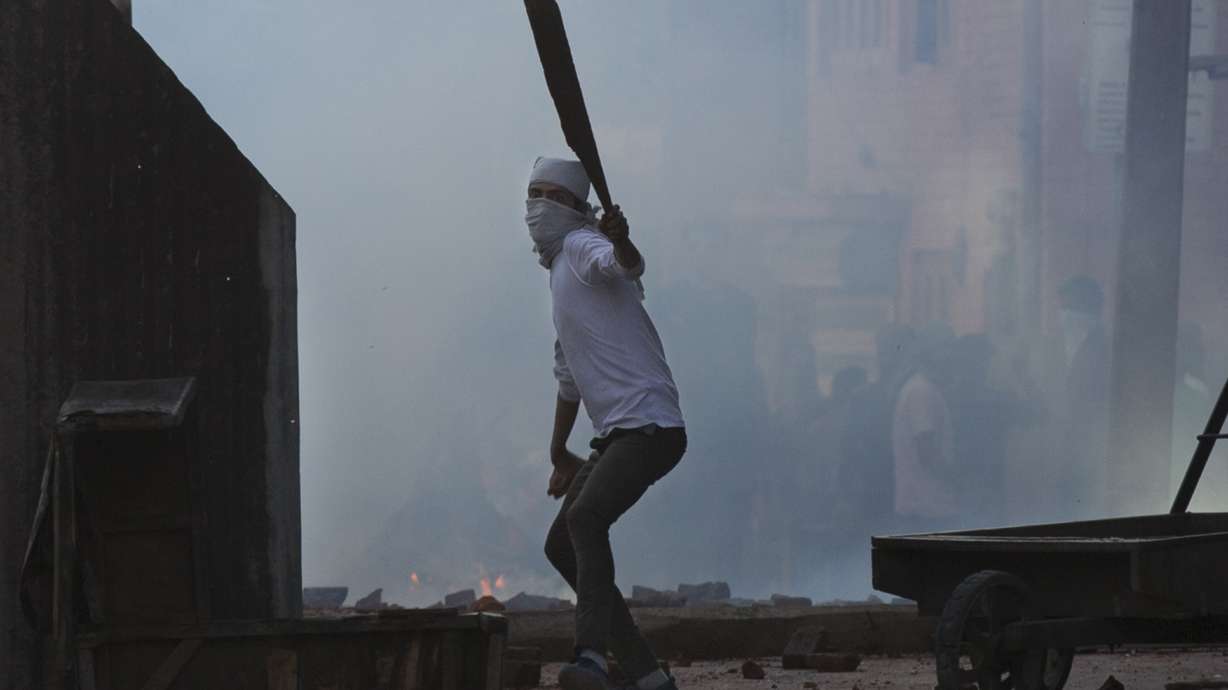 India re-imposes curfew in Kashmir city, but clashes persist