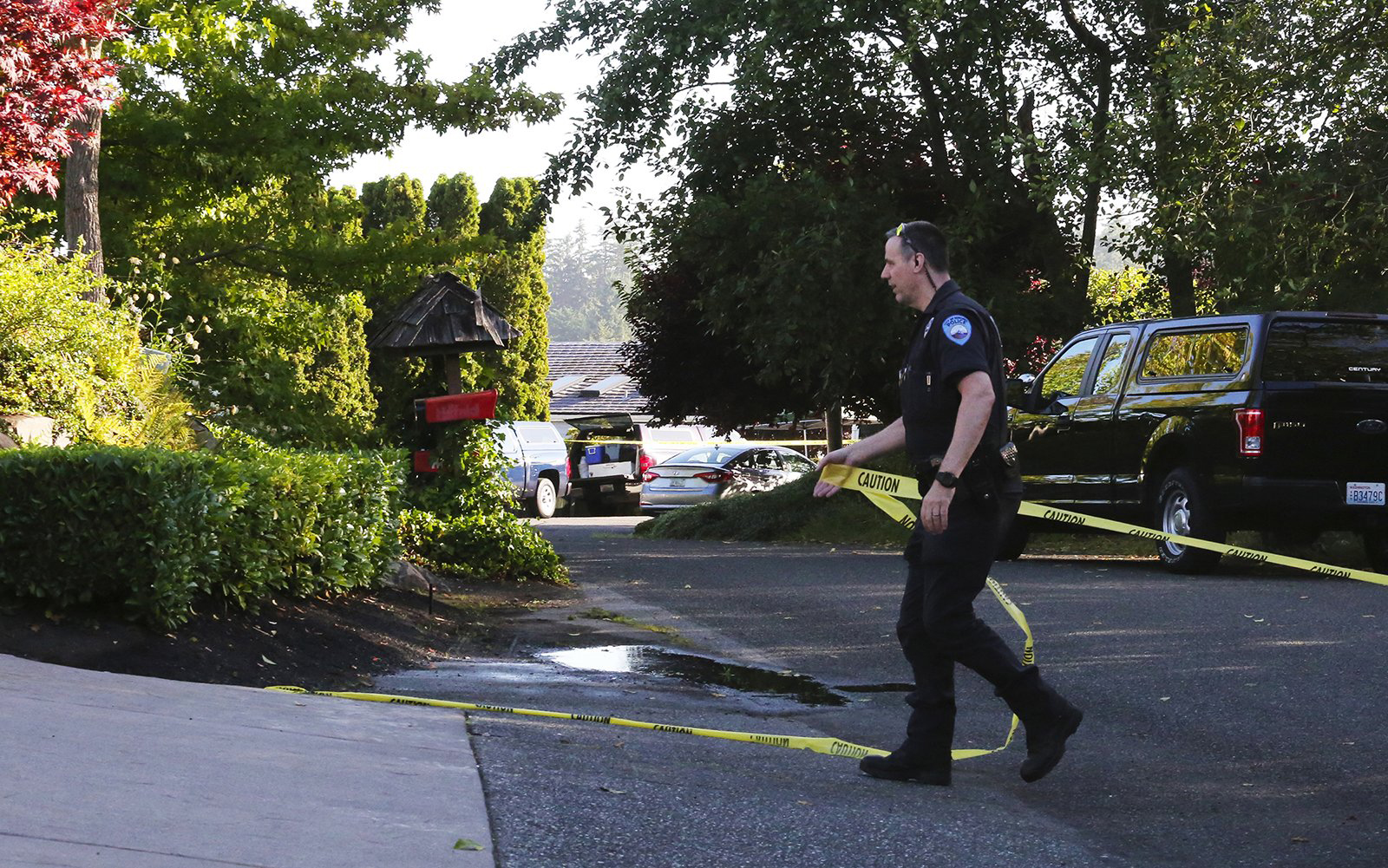The Latest: Vigils held for Washington shooting victims