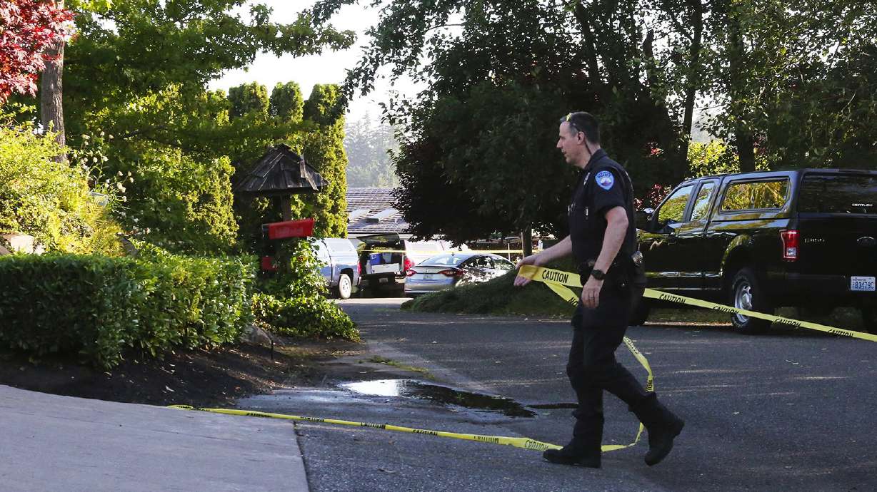 The Latest: Vigils held for Washington shooting victims