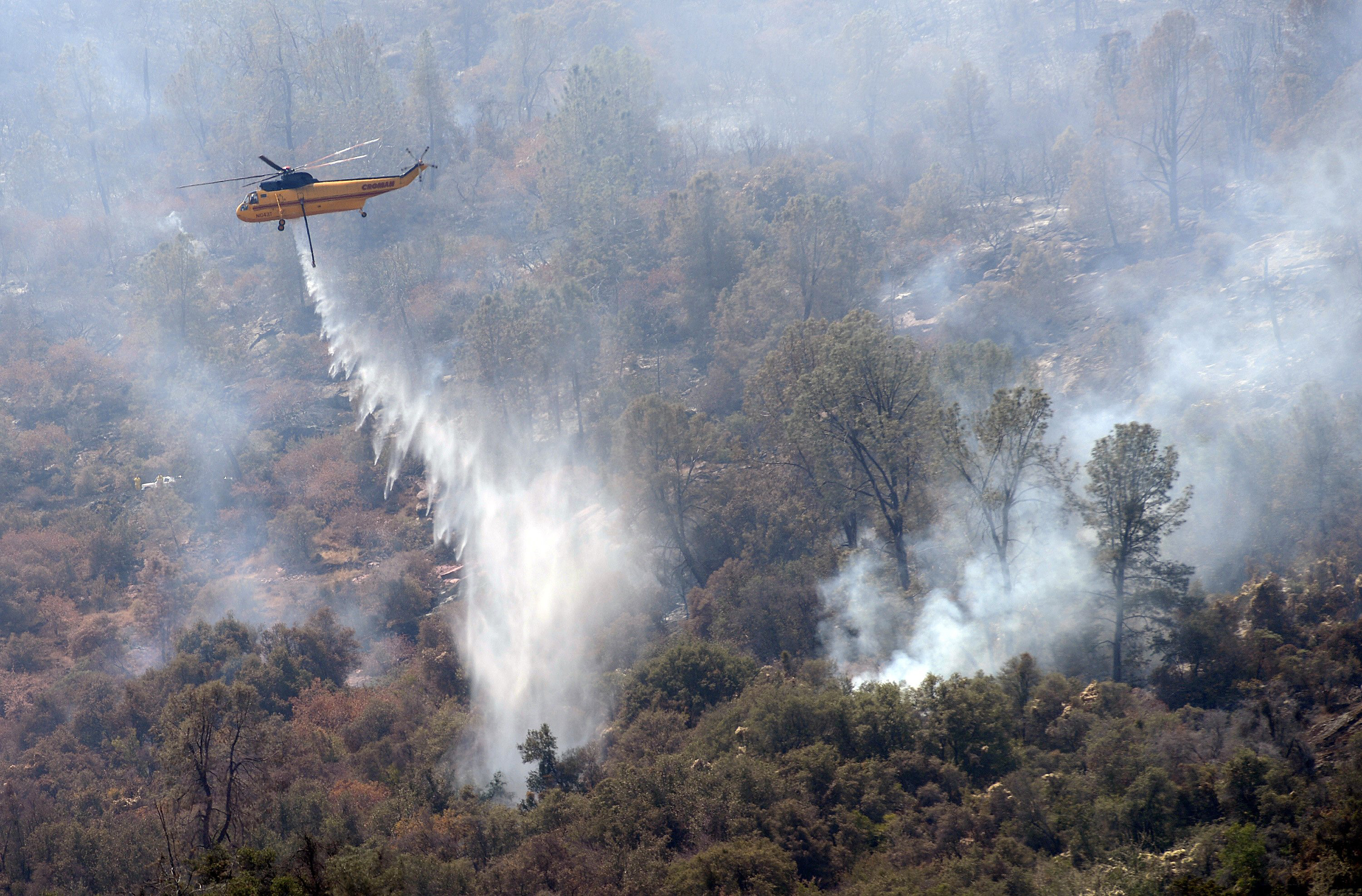The Latest: Washington fire under control, structures lost