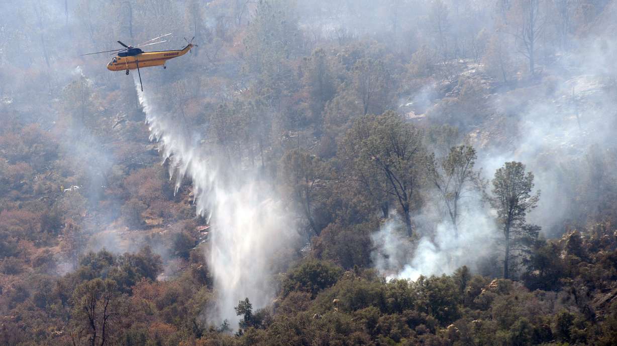 The Latest: Washington fire under control, structures lost