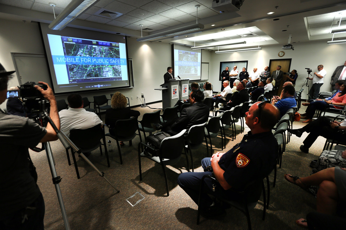 Public safety officials watch a short video about the new product as they announce the chosen vendor to provide a unified 911 software system to improve emergency response during a press conference at the Valley Emergency Communications Center on Tuesday, Aug. 2, 2016. (Photo: Scott G Winterton, Deseret News)