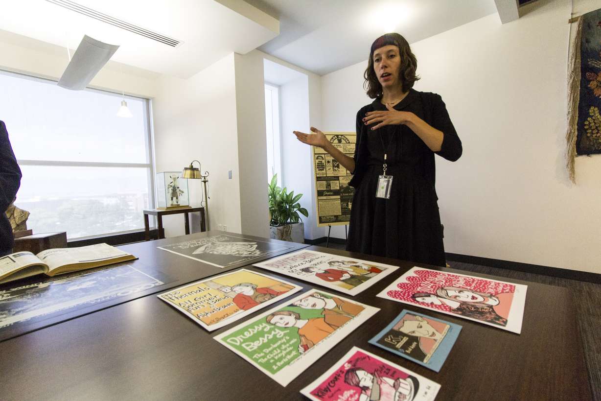 Julia Huddleston, archivist at the university's Marriott Library, discusses the artwork from local artist Leia Bell (Photo: Carter Williams, KSL.com)