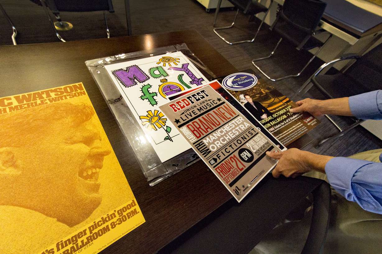 Ron Bitton, curator of historical maps and newspapers for the Marriott Library, takes a look at posters for the band Brand New and for musician Max Weinberg (Photo: Carter Williams, KSL.com)