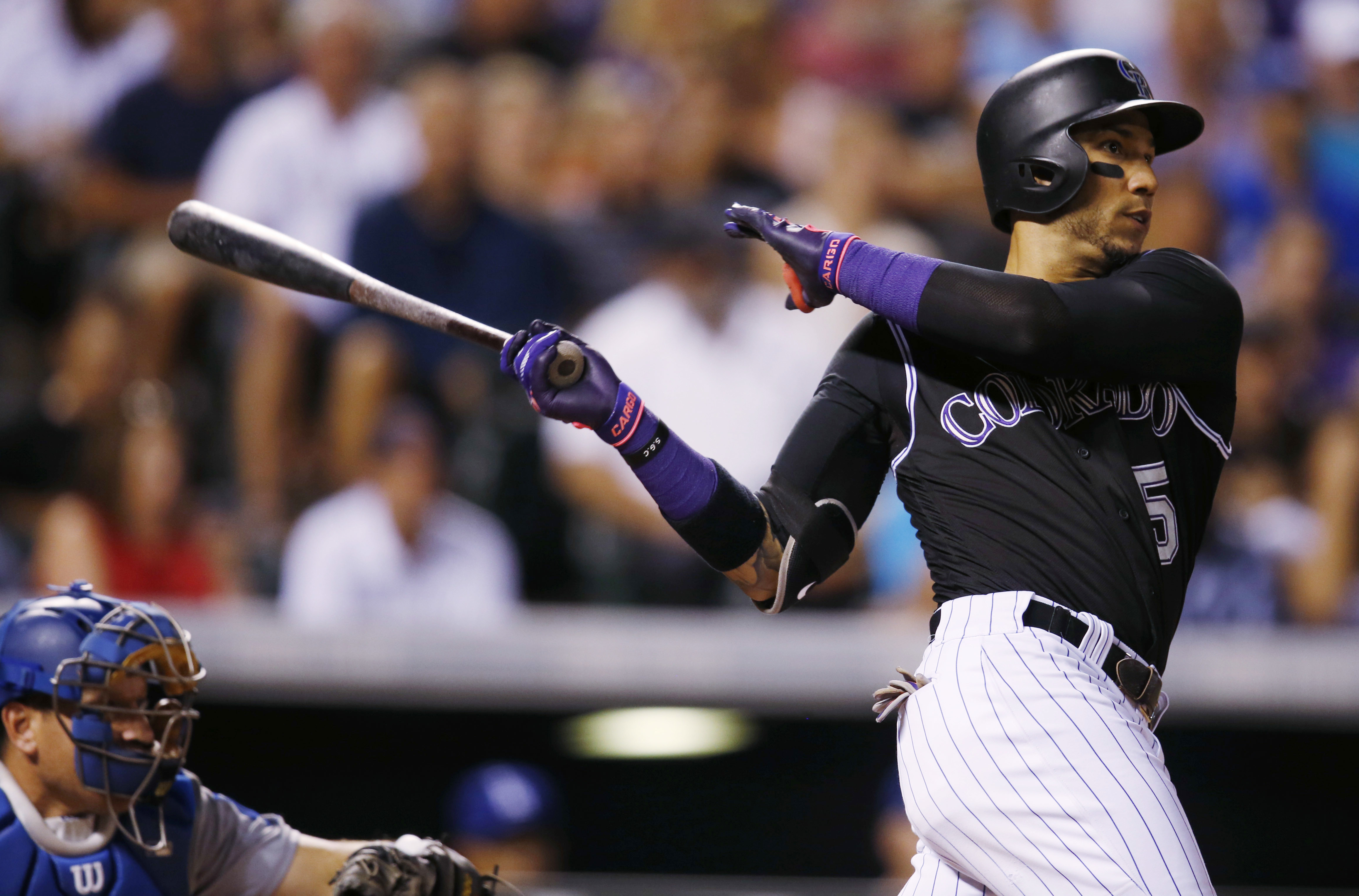 Gonzalez hits 2 HRs before leaving game with ankle injury