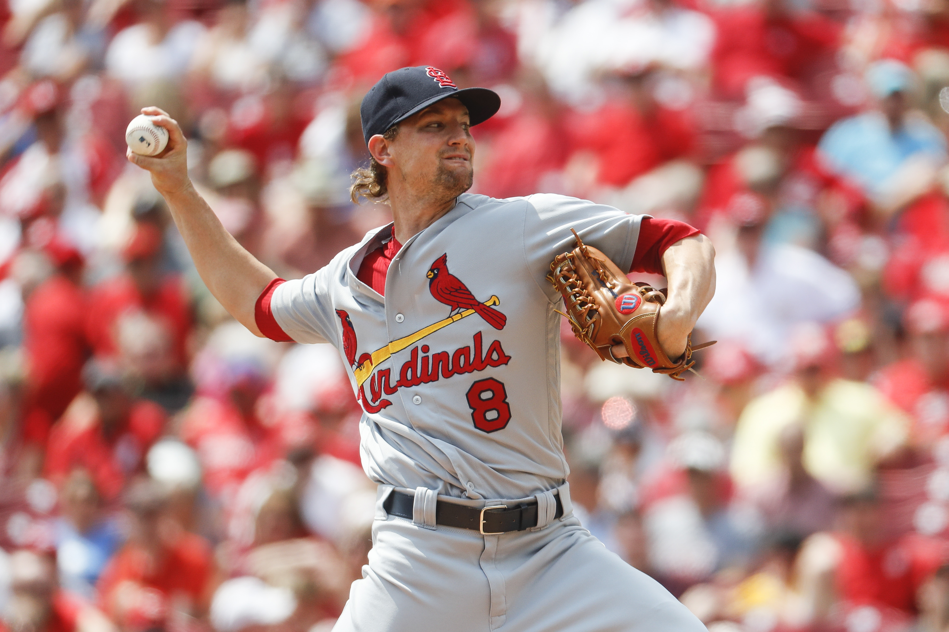 Phillips leads Reds over Cardinals 7-0 for rare series win