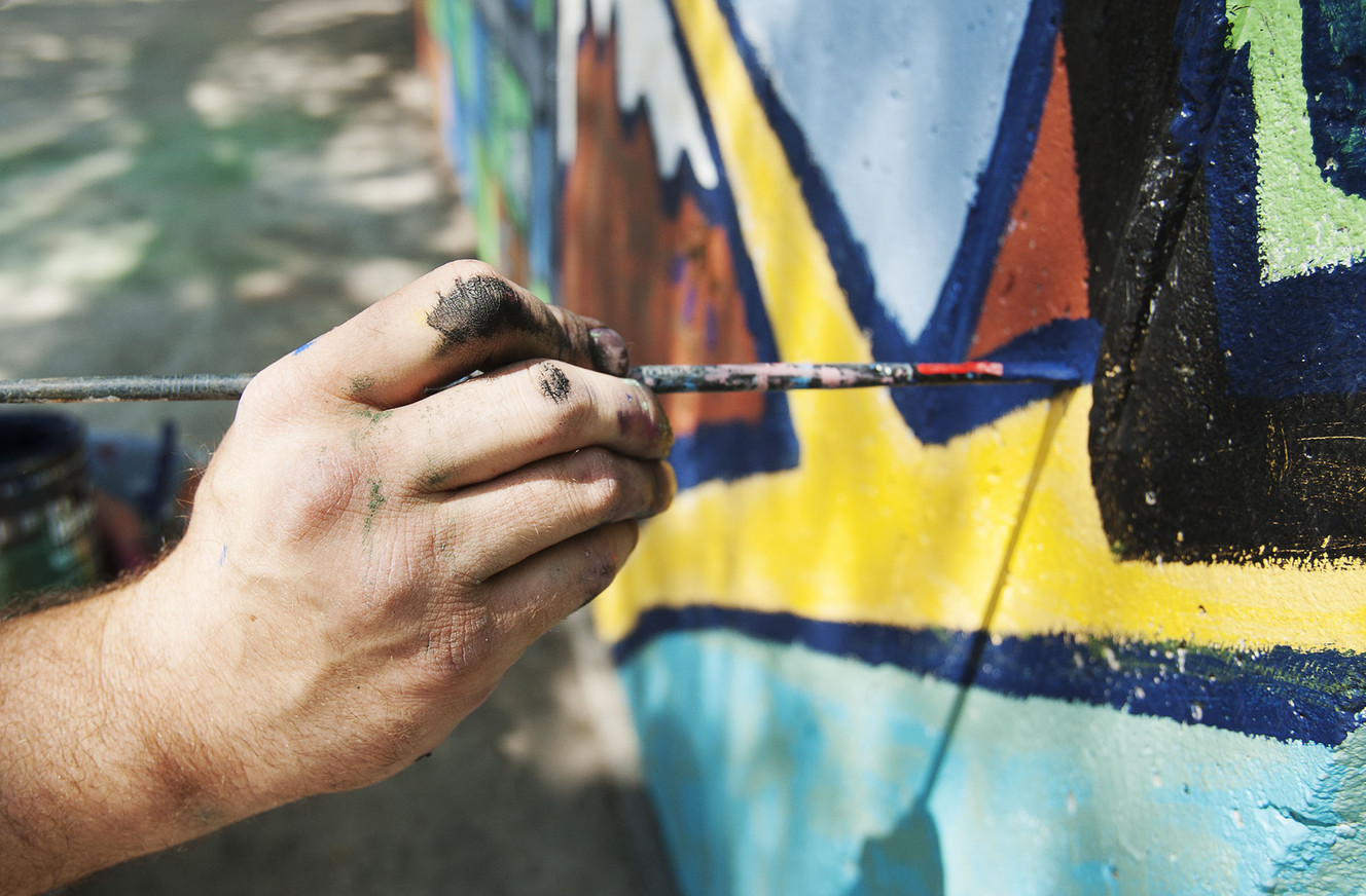 Local artist Roger Whiting touches up a section of the new mural at West View Park in West Valley City on Thursday, Aug. 4, 2016. (Photo: Hans Koepsell, Deseret News)