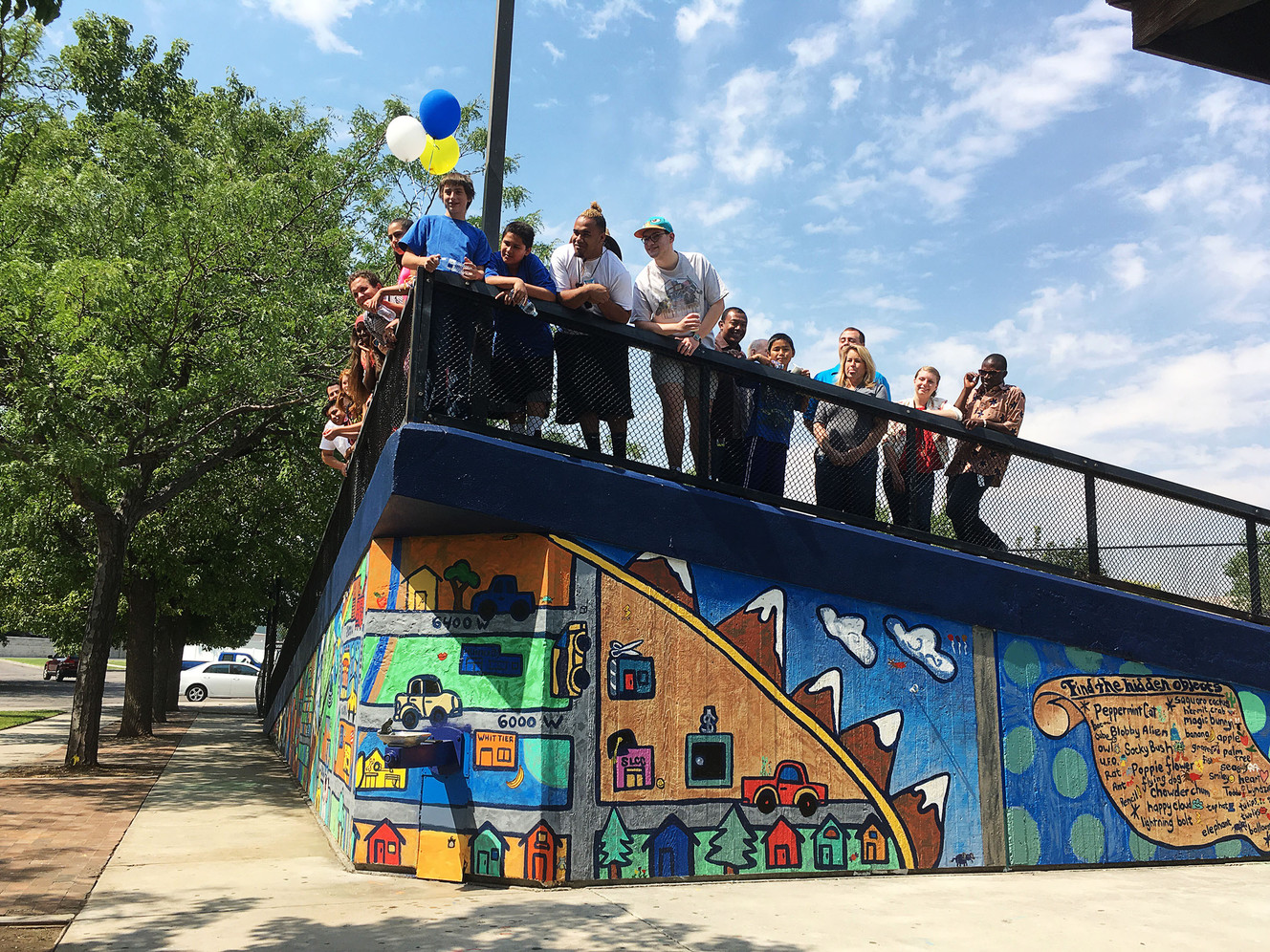West Valley community members stand for a group photo on the new mural in West View Park in West Valley City on Thursday, Aug. 4, 2016. (Photo: Abby Hobbs, Deseret News)