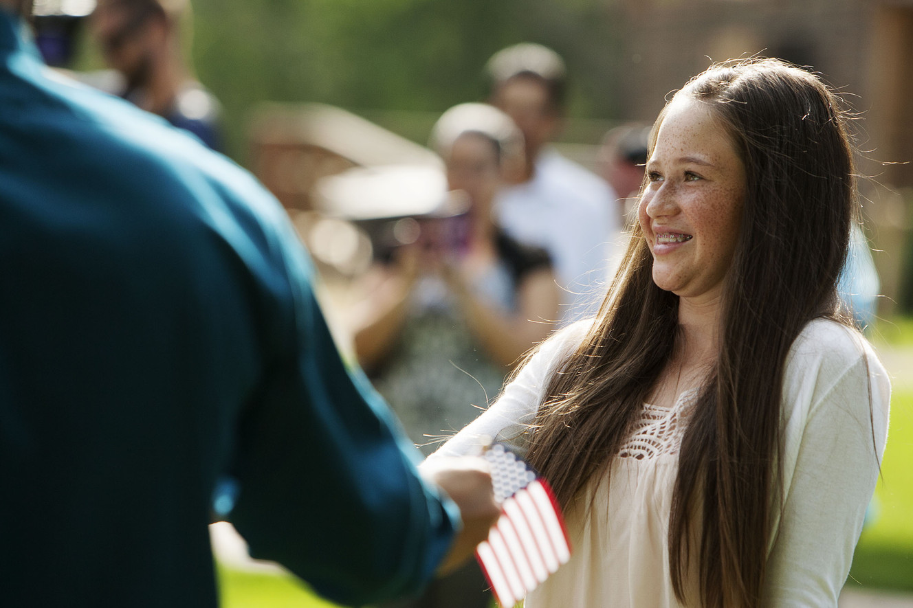 Natalia Ciro, who was born in Colombia, smiles as she receives her U.S. citizenship certificate at Wheeler Historic Farm in Murray, Friday, Aug. 5, 2016. U.S. Citizenship and Immigration Services presented citizenship certificates to 23 children, ages 6 to 17, during a Friday's special ceremony. (Photo: Hans Koepsell, Deseret News)