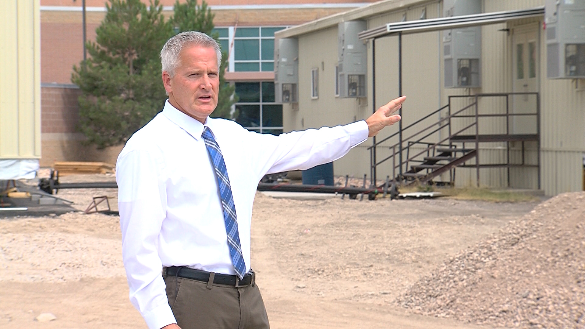 Westlake principal Gary Twitchell points to one of the portable classrooms outside of the high school (Photo: KSL-TV)