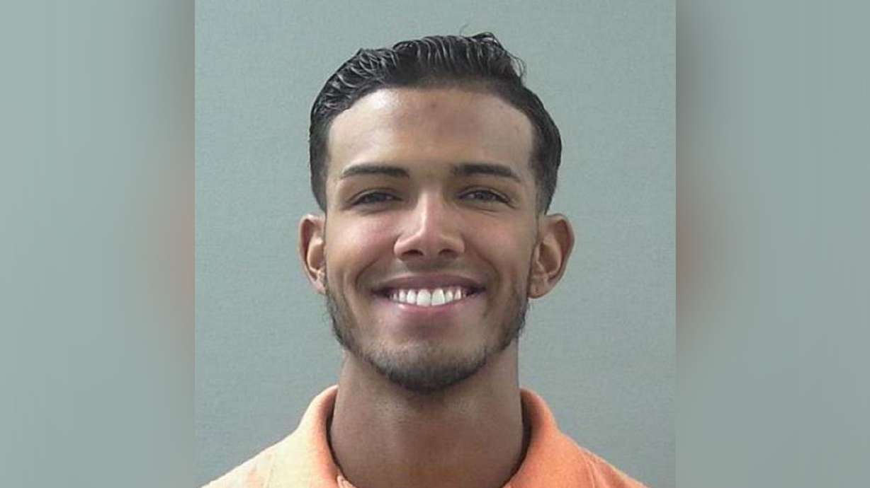 Man awaiting trial for murder charged with gun-related offense