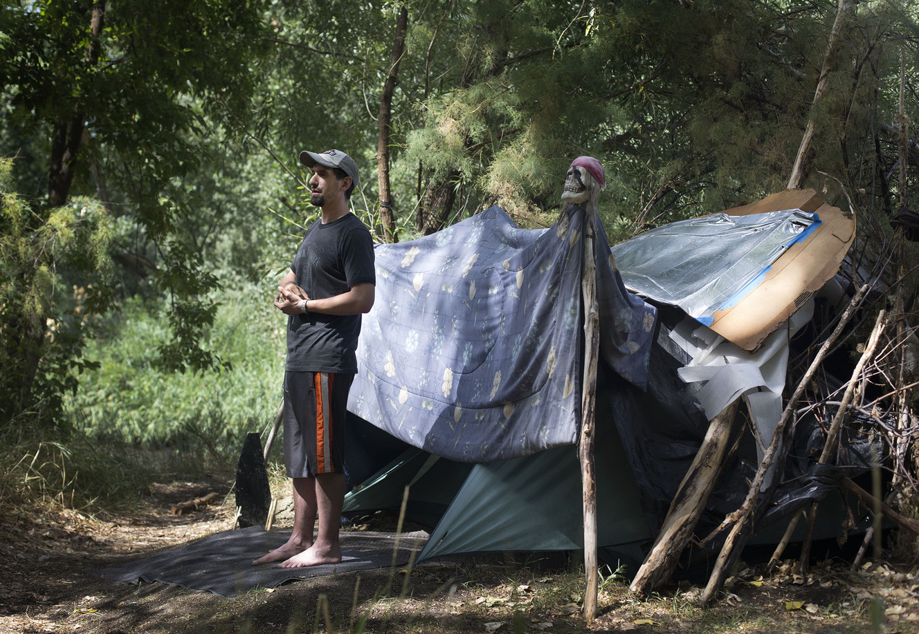 Jaren Corral has been living in a tent beside the Jordan River for more than two years. Recovering from a surgery has prevented him from getting back to work as a construction worker. He views his time living by the river as temporary until he is healed and able to return to work. He said watching the drug overdoses and living with bedbugs for three months at the homeless shelter almost killed him. Photograph taken in West Valley City on Wednesday, Aug. 10, 2016. (Photo: Laura Seitz, Deseret News)