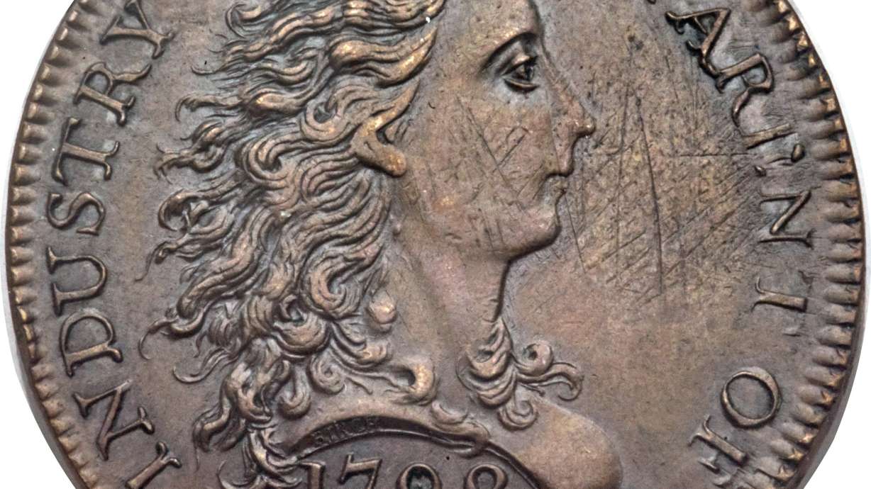 The Latest: 2 early US 1-cent coins sell for $869,500