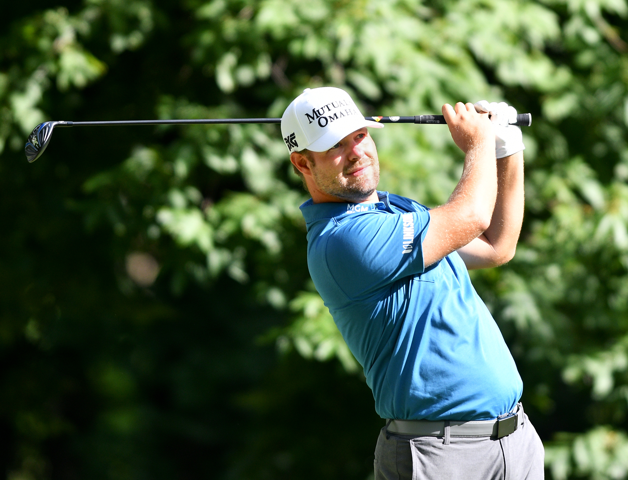 Ryan Moore finishes in dark, leads John Deere Classic