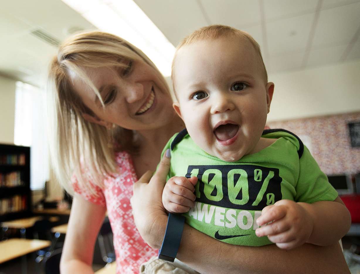 Nichole Paul, an English teacher at Granger High School, holds her 11-month-old son, Lucas, in her classroom in West Valley City on Thursday, Aug. 11, 2016. (Photo: Hans Koepsell, Deseret News)