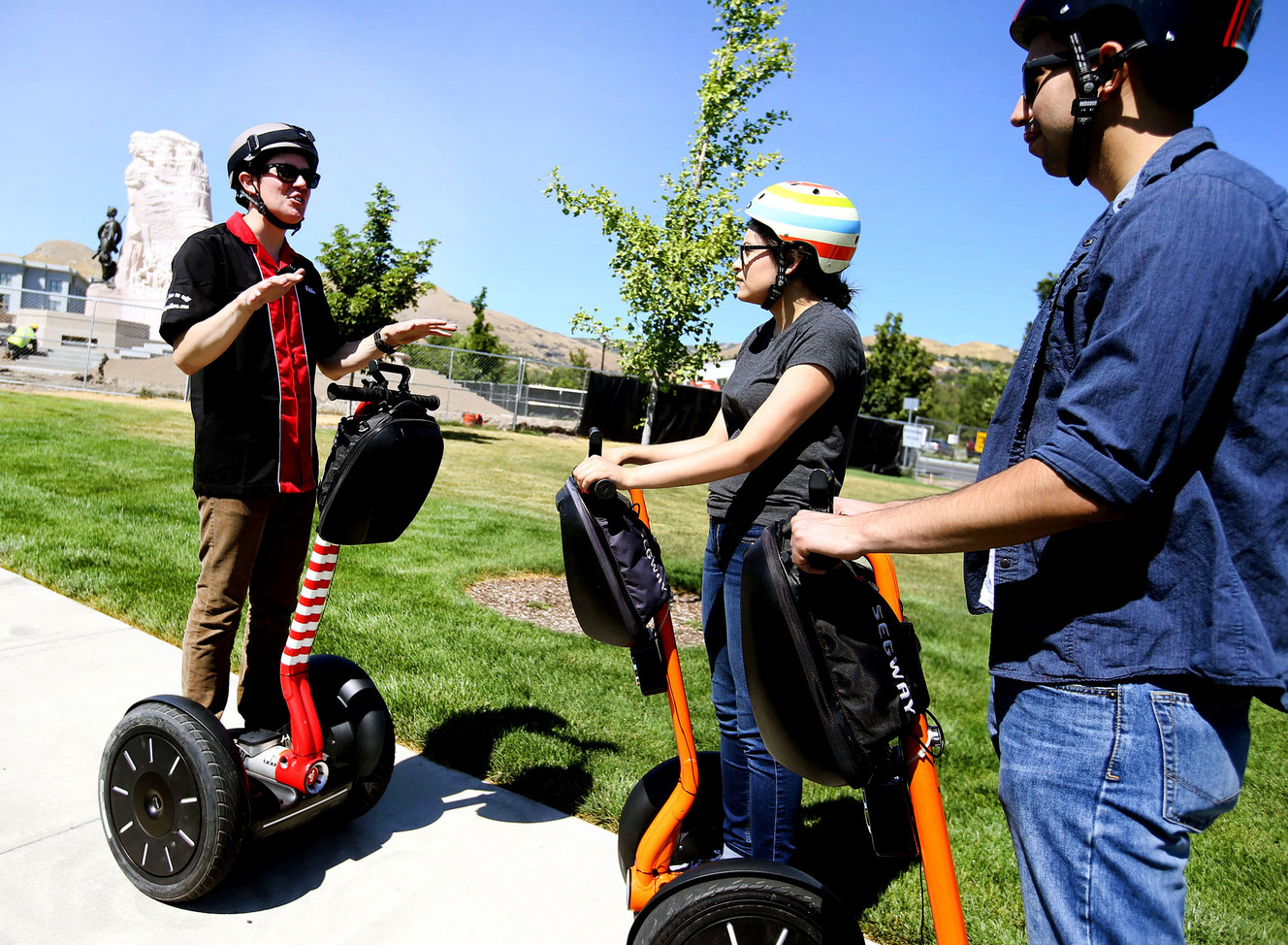 Robbie Preece, left, of Salt City Rollers, gives Jessica Miranda and Adrian Luna some facts about Utah history during a Segway tour of Salt Lake City on Thursday, Aug. 11, 2016. (Photo: Laura Seitz, Deseret News)