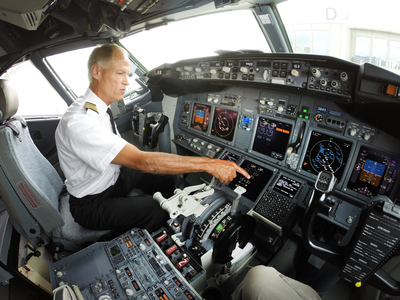 Delta pilot Jon Pendleton points out the new controls on a 737-900 plane as Federal Aviation Administration officials announced a new communication system between the tower and flight crews at the Salt Lake City International Airport on Monday, Aug. 15, 2016. (Photo: Scott G Winterton, Deseret News)