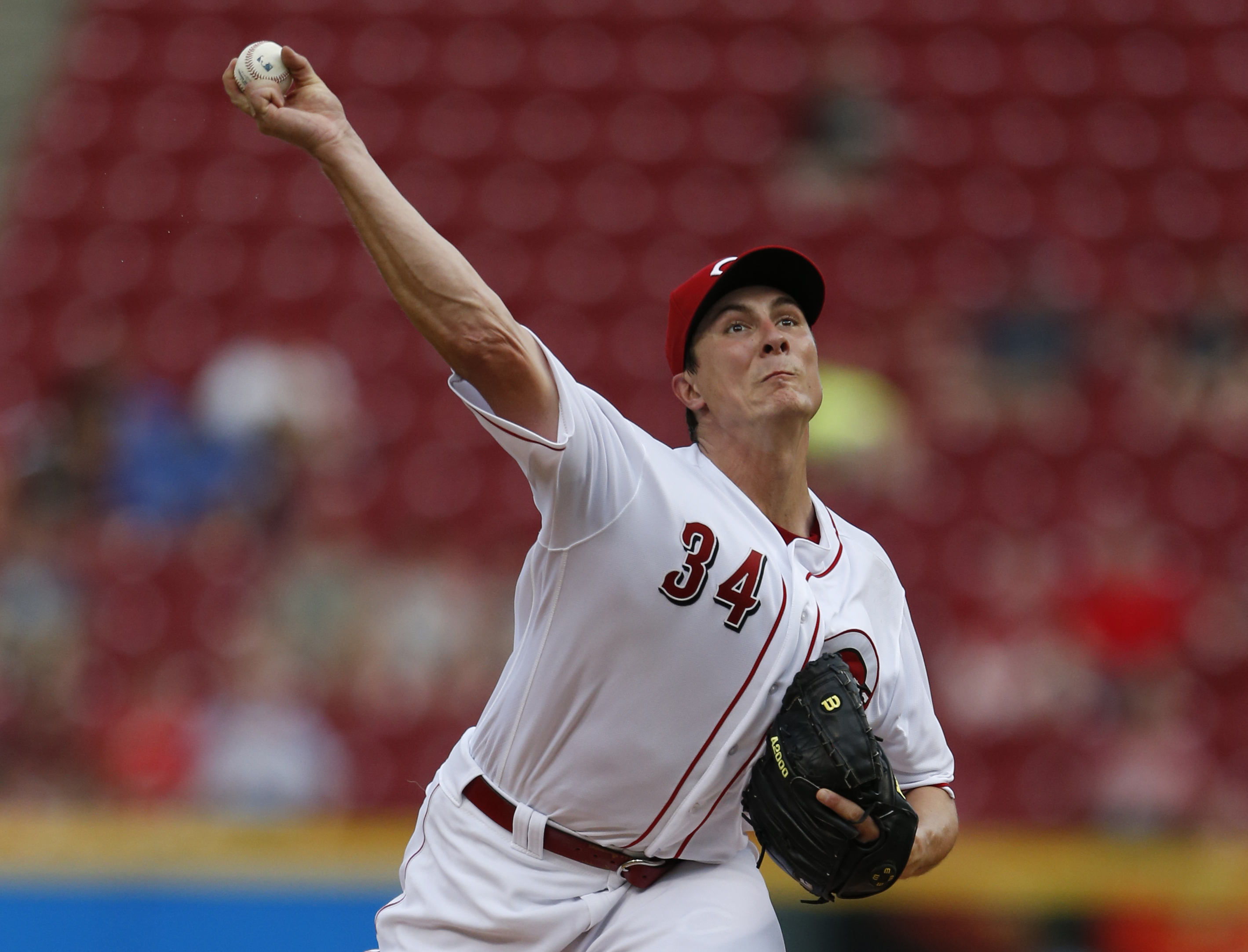 Phillips leads Reds to 3-2 comeback win over Marlins