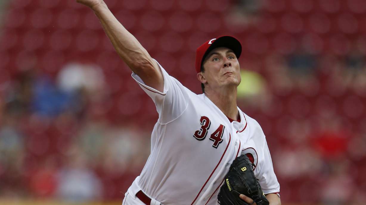 Phillips leads Reds to 3-2 comeback win over Marlins