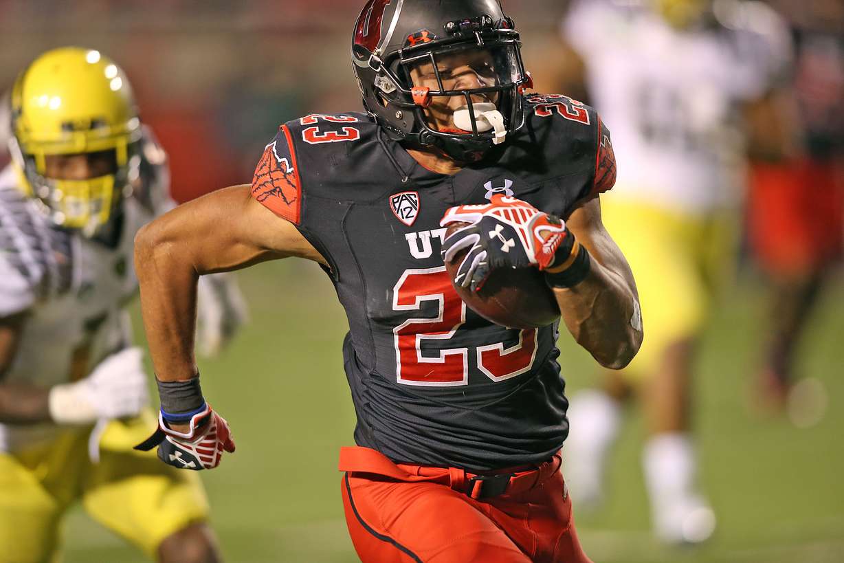 Utah Utes running back Devontae Booker (23) runs for a touchdown as the University of Utah and University of Oregon play PAC 12 football Saturday, Nov. 8, 2014, in Salt Lake City. (Photo: Tom Smart, Deseret News)