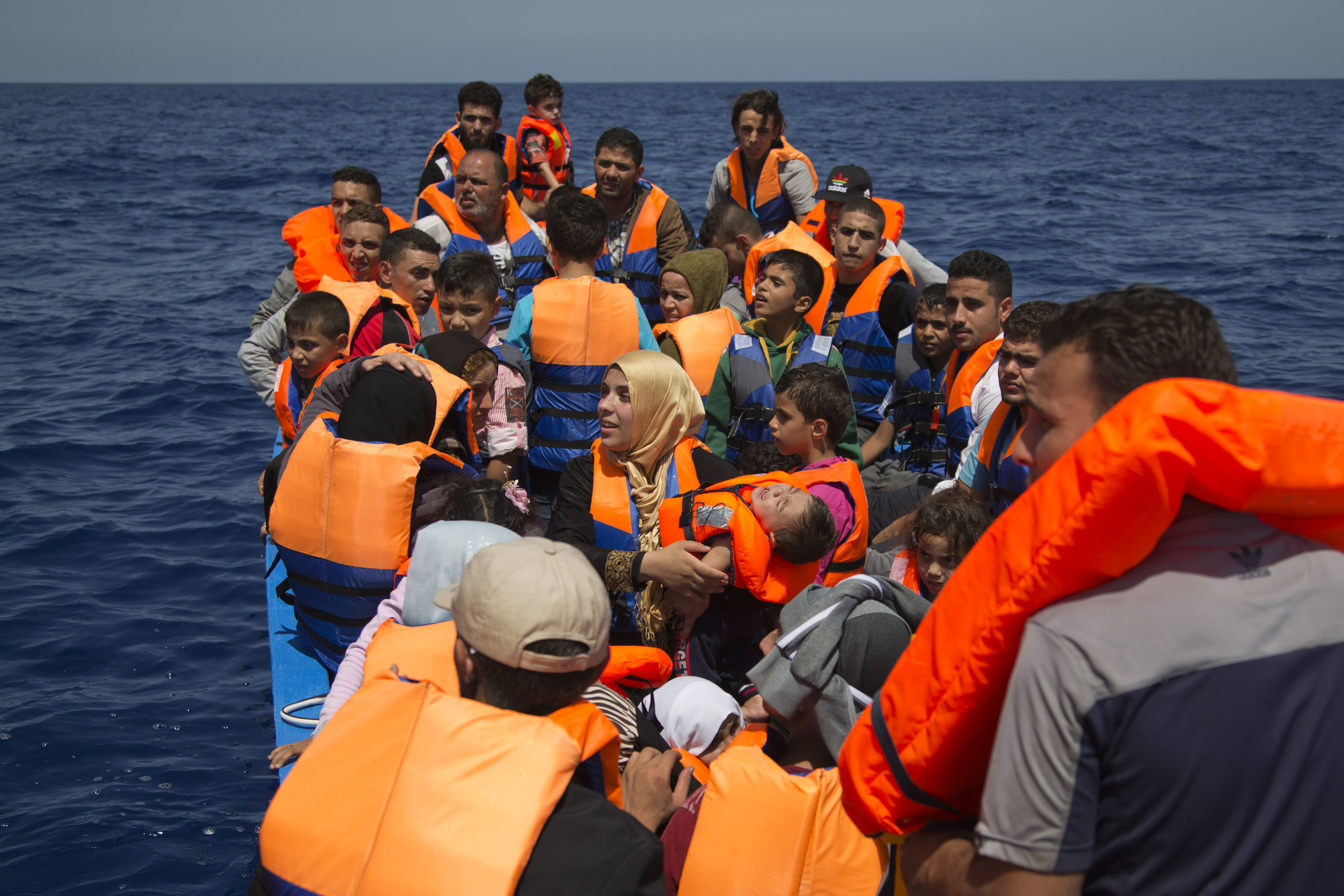 AP witnesses rescue of migrants off Libya, 4 bodies found