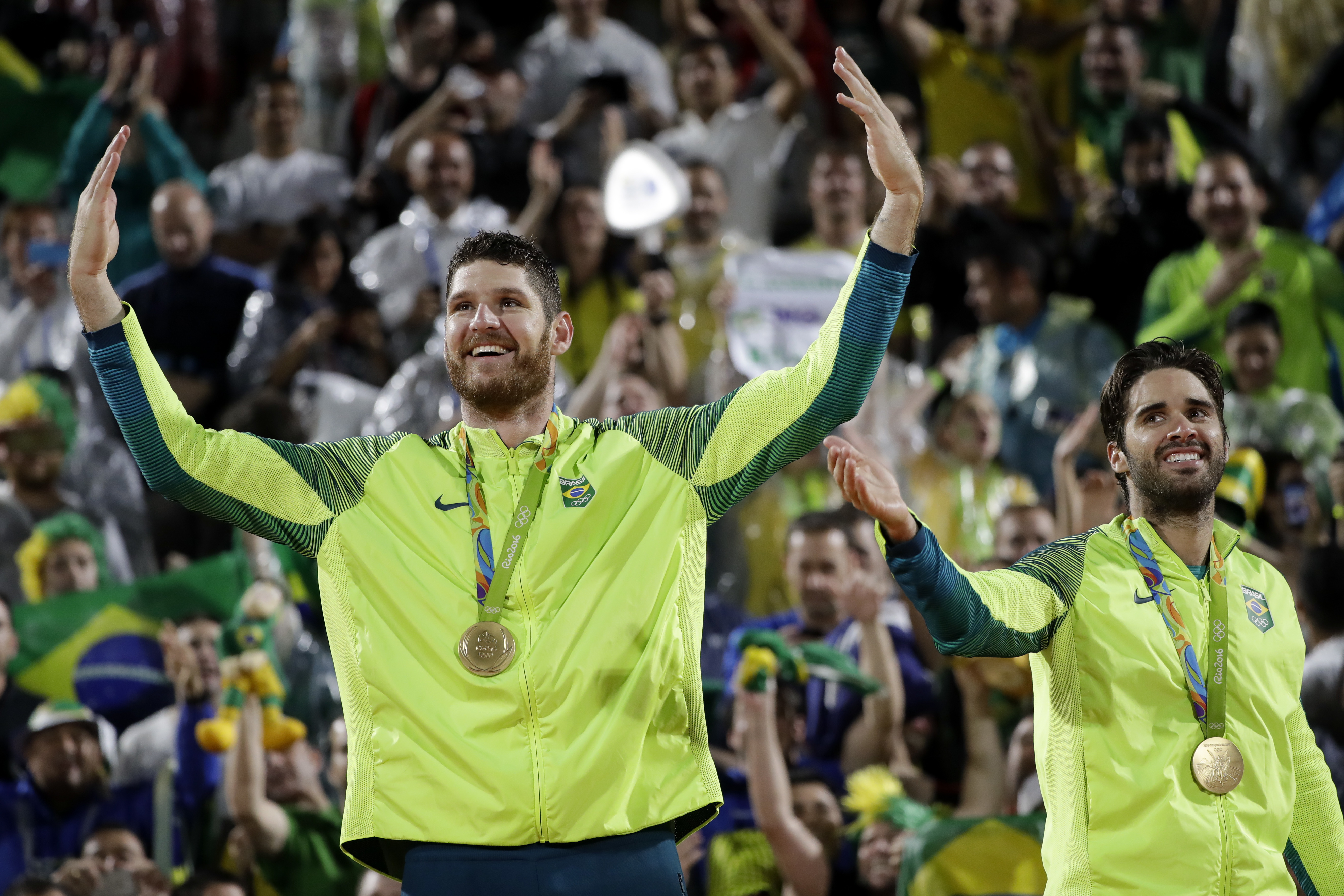 The Latest: Bolt celebrates by throwing the javelin _ Really