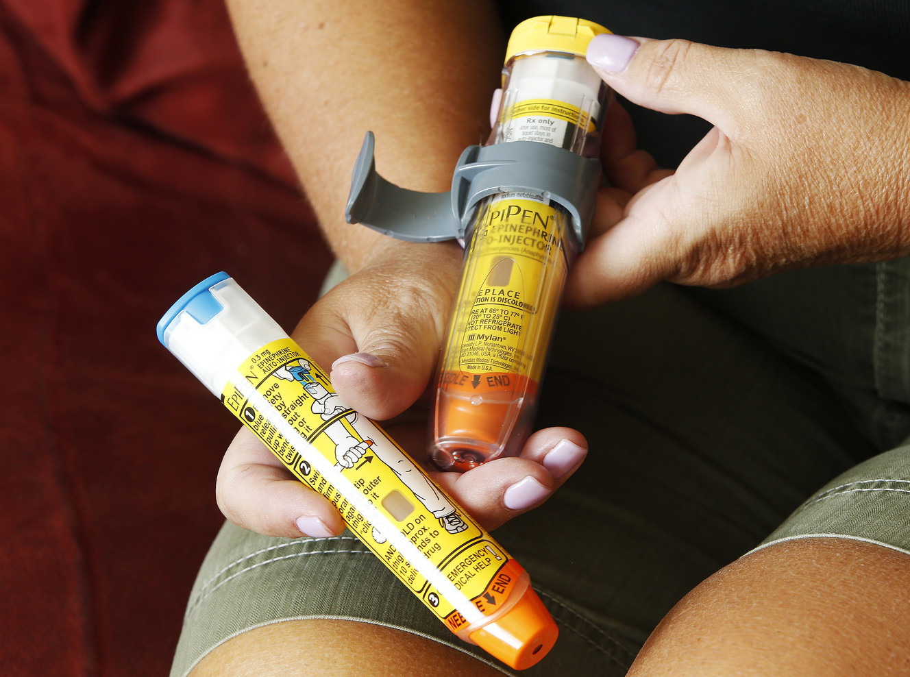 Kathleen Sampson holds her EpiPen at her home in Saratoga Springs on Friday, Aug. 19, 2016. Sampson is allergic to wasps. Rising EpiPen prices are putting the crunch on families and emergency medical technicians alike. (Photo: Jeffrey D. Allred, Deseret News)