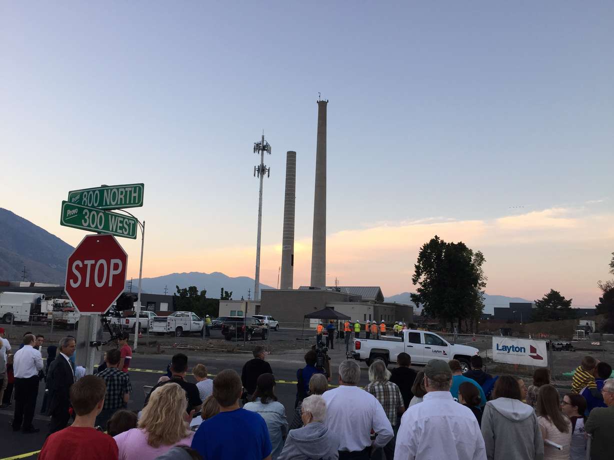 Provo residents take photos and talk as they turn out to watch as the 77-year-old Provo Power smokestacks are demolished on Sunday, Aug. 21, 2016. (Photo: Devon Dewey, KSL.com)