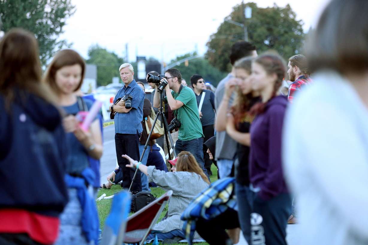 Provo residents take photos and talk as they turn out to watch as the 77-year-old Provo Power smokestacks are demolished on Sunday, Aug. 21, 2016. (Photo: Scott G. Winterton, Deseret News)