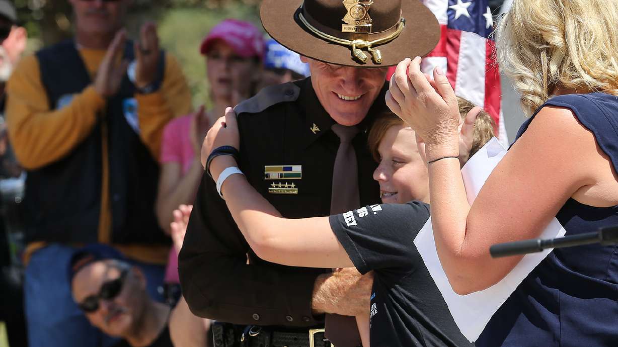 Photos: Children of the fallen present pins to memorial's guardians