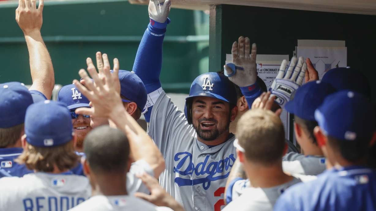 Gonzalez hits 3 of Dodgers' 7 homers for 18-9 win over Reds