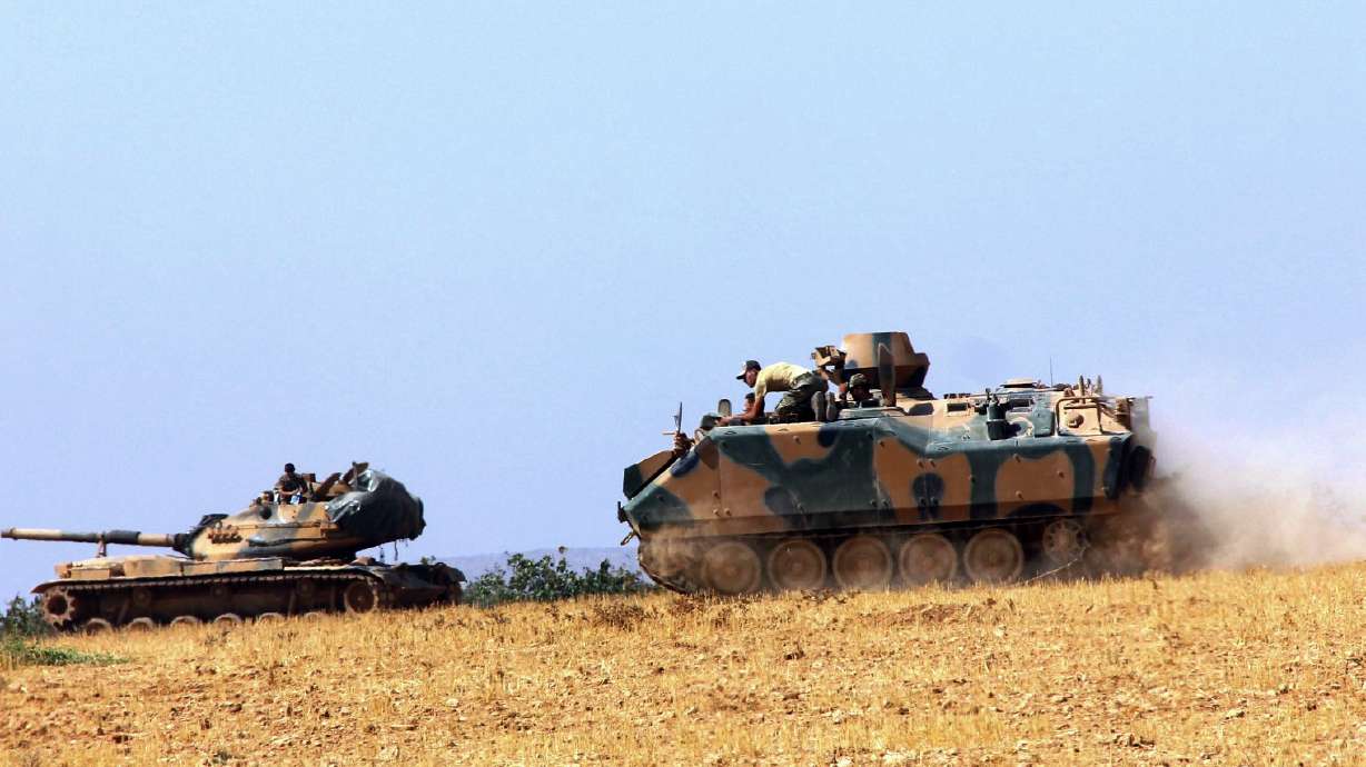 The Latest: Erdogan says Syrian rebels take back border town