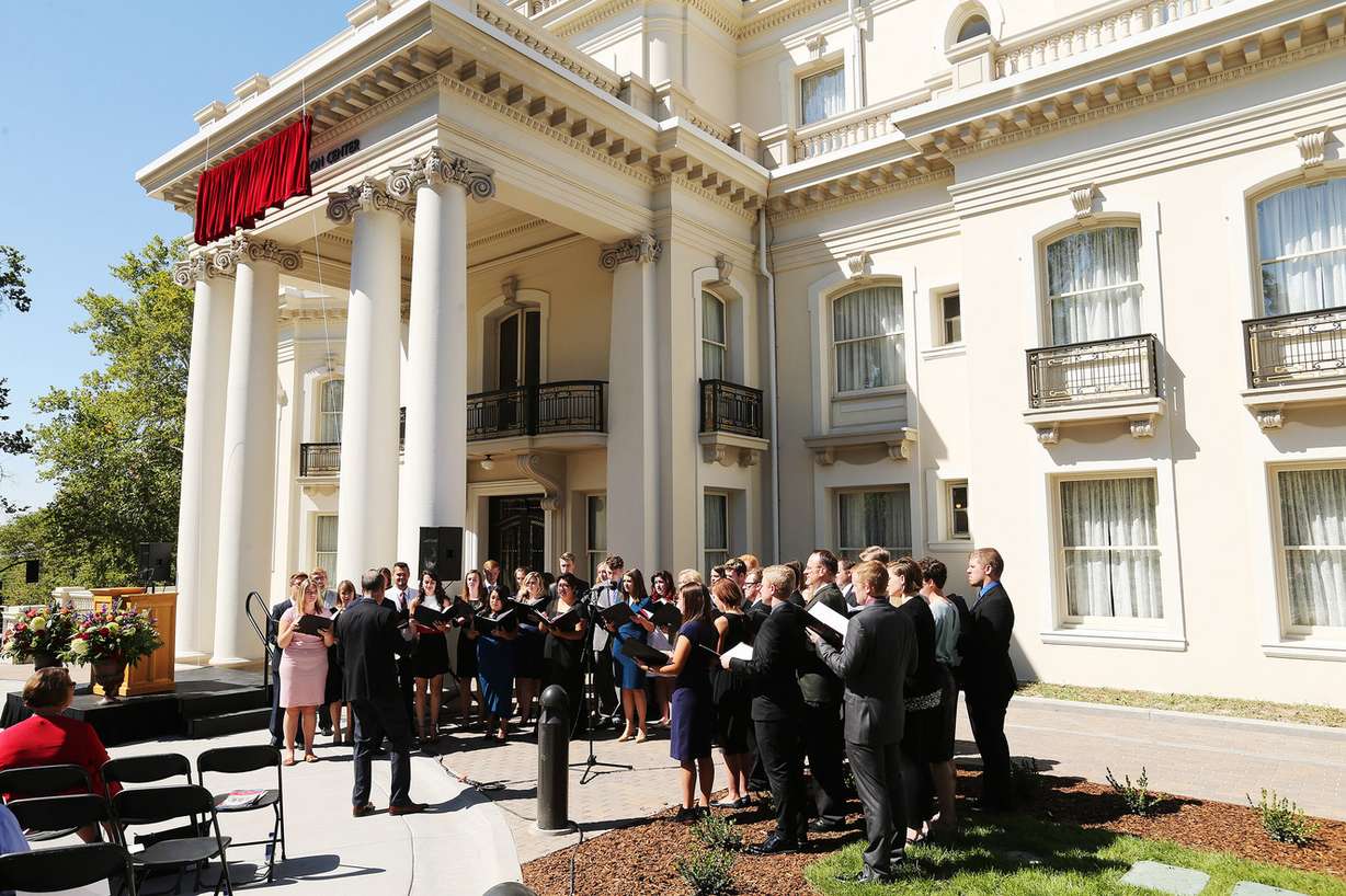 The University of Utah Chamber Choir sings at the unveiling of the newly refurbished Enos A. Wall Mansion in Salt Lake City on Wednesday, Aug. 24, 2016. The mansion, which will be named the Thomas S. Monson Center after the current president of the LDS Church, will be home to the U.'s Kem C. Gardner Policy Institute. The LDS Church donated the building to the U. in 2014, and President Monson is an alumnus of the university. (Photo: Jeffrey D. Allred, Deseret News)