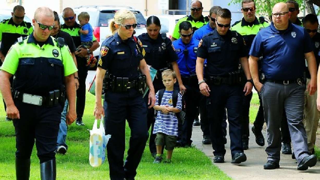 'Blue family' steps up for son of fallen cop on first day of school