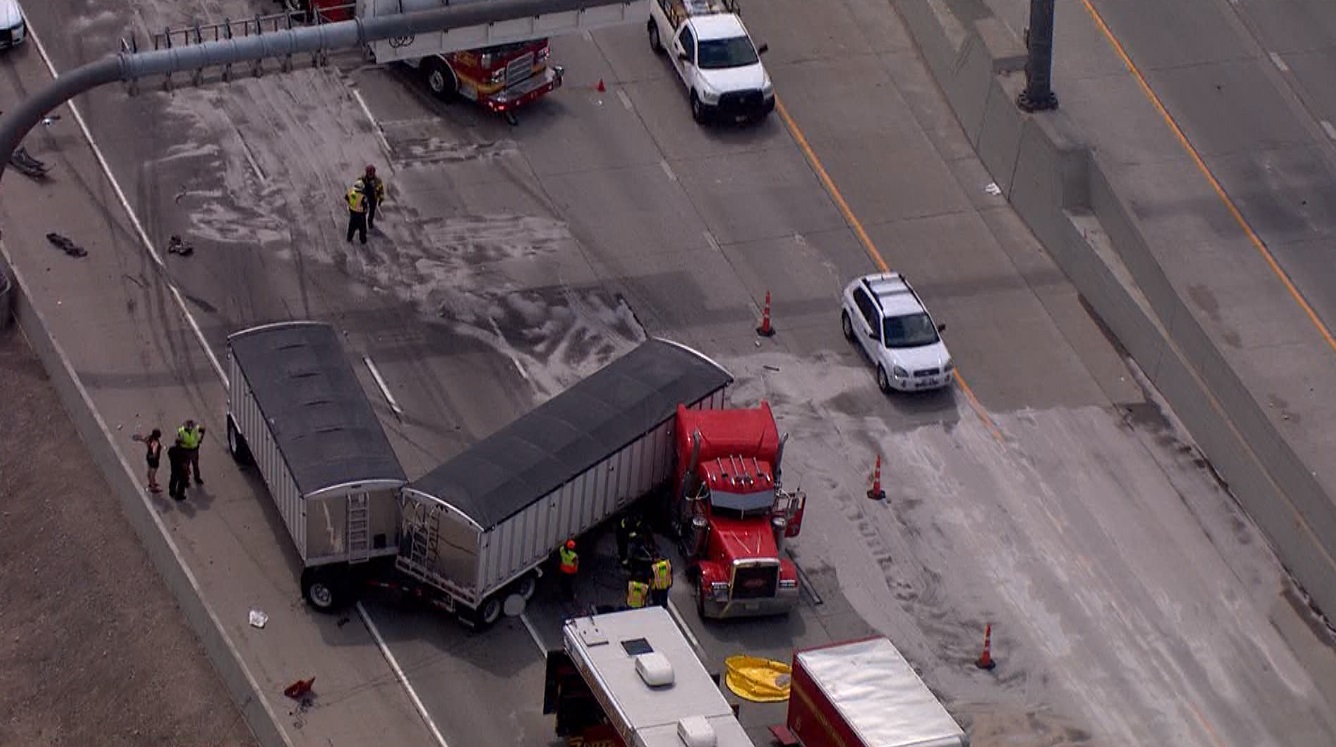 A crash involving multiple vehicles, including a jack-knifed semitruck, closed multiple lanes in a section of northbound I-15, leaving some traffic backed up in the area. (Photo: Chopper 5, KSL TV)