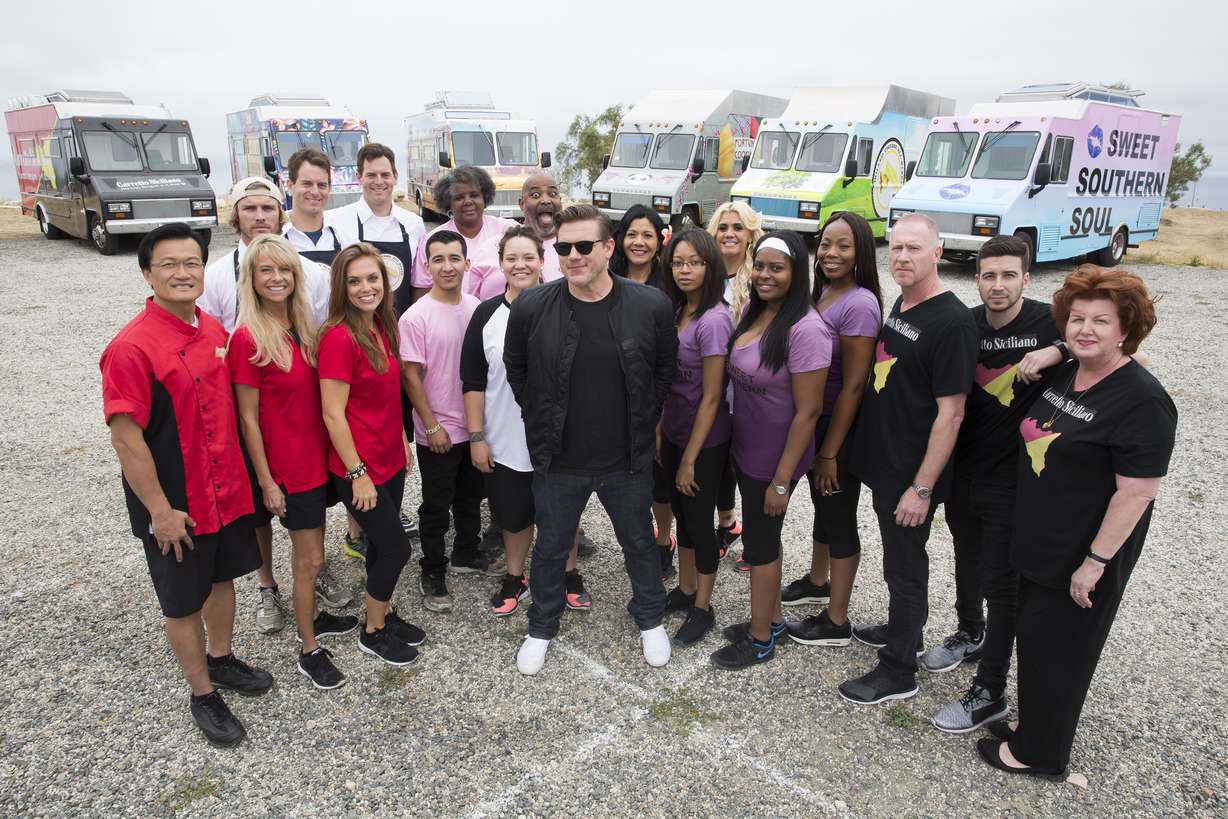 Host Tyler Florence poses with all six teams competing for the grand prize of $50,000 in Season 7 of The Great Food Truck Race. (Food Network)