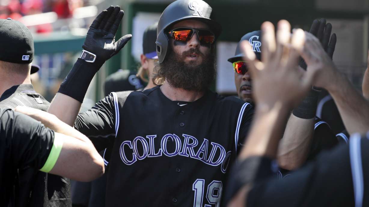 Blackmon homers twice as Rockies beat Nats 9-4 in 11 innings