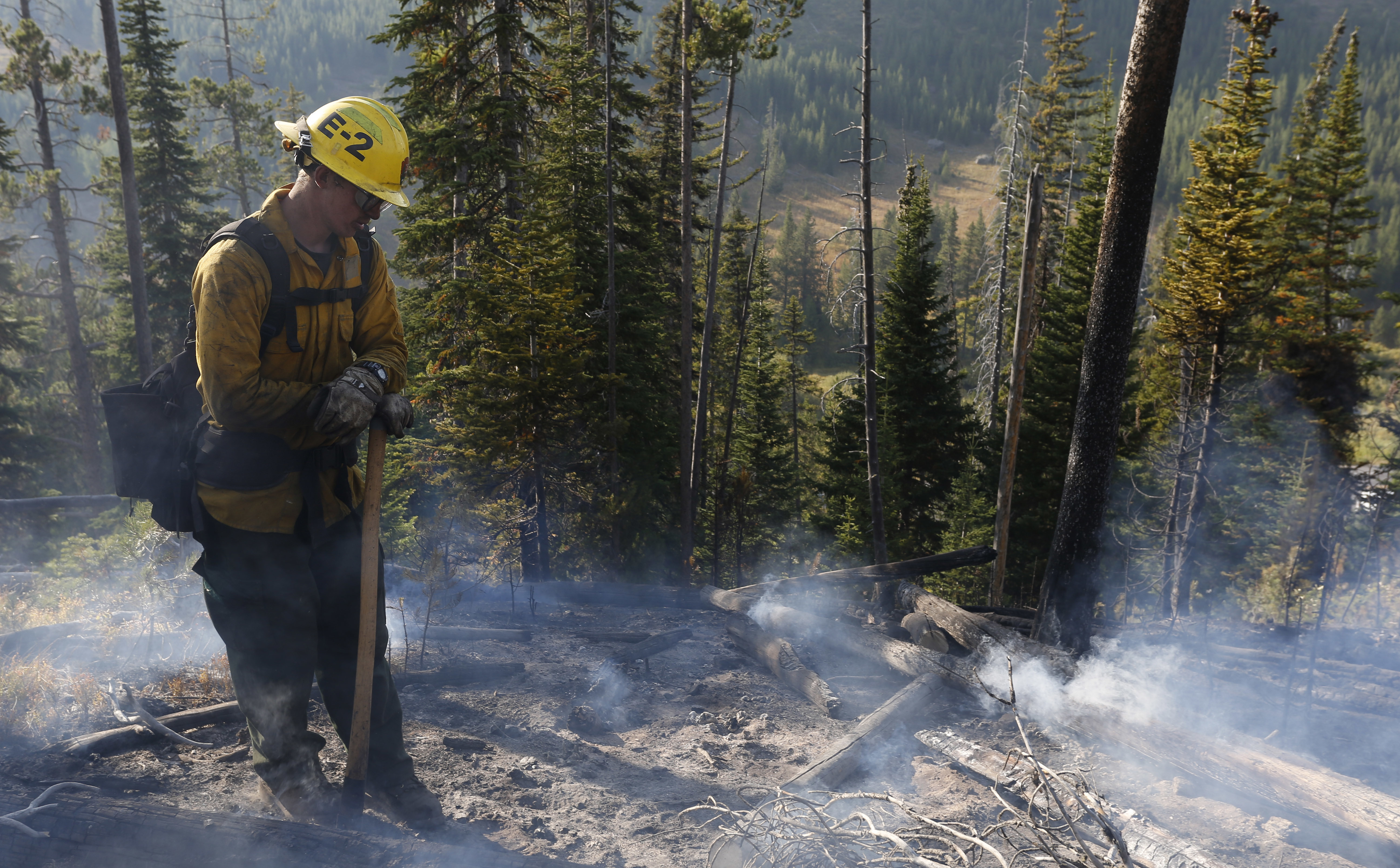 Wildfire blocking Yellowstone entrance smolders on