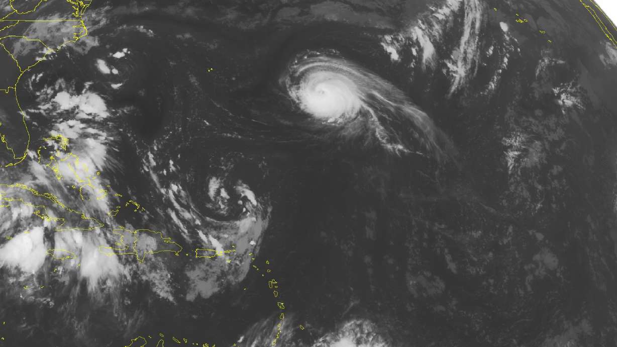 The Latest: North Carolina warily watches tropical weather